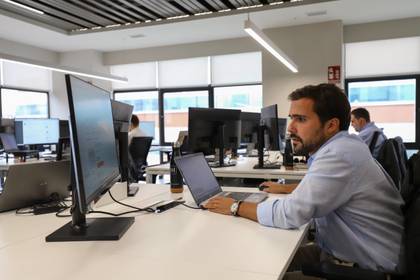 METRICA professional working at a computer in the office